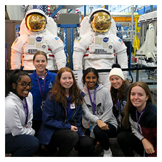 Loreto students at NASA's engineering lab with Astronaut space suits