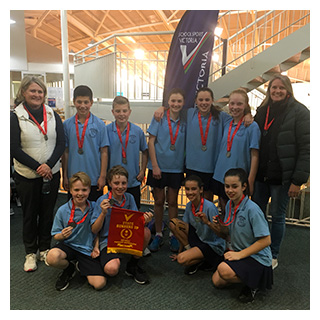 St Thomas the Apostle Blackburn students with their runner up medals from the mixed netball state final