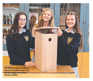 Altitude students Talisha, Aimee and Jemima with a nest box prototype for bushfire-affected wildlife. Photo courtesy of the Mornington Peninsula Leader.